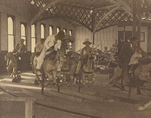 People Riding on a Carousel